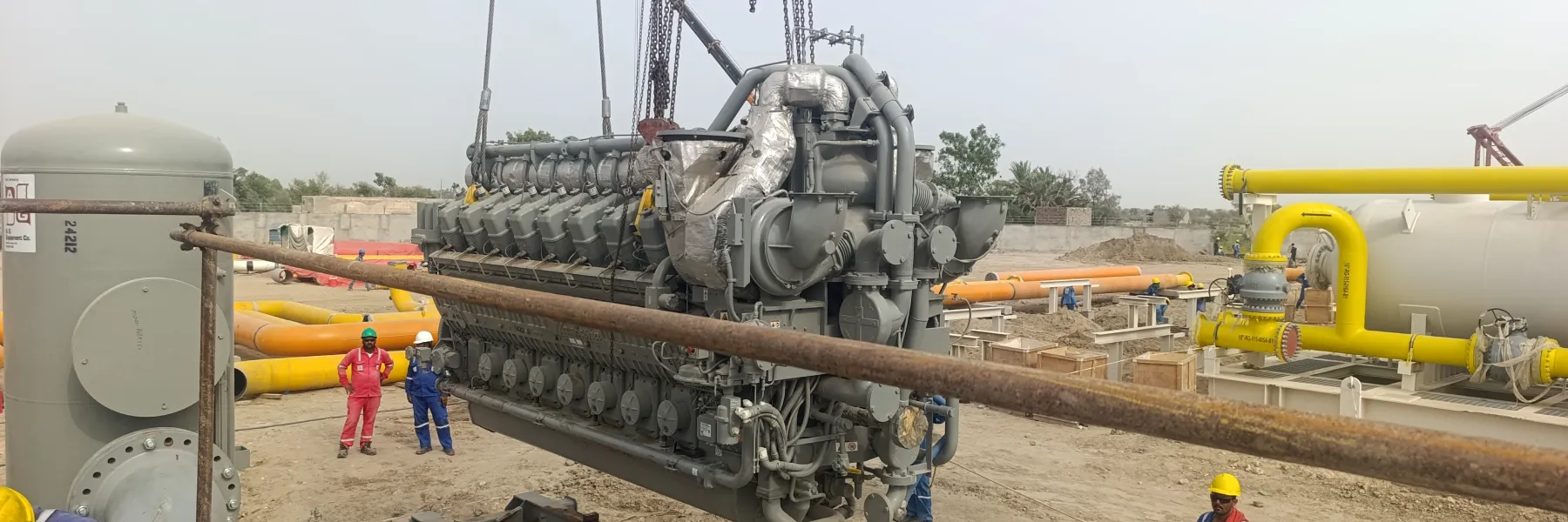 Crane lift of a gas engine during compressor package installation